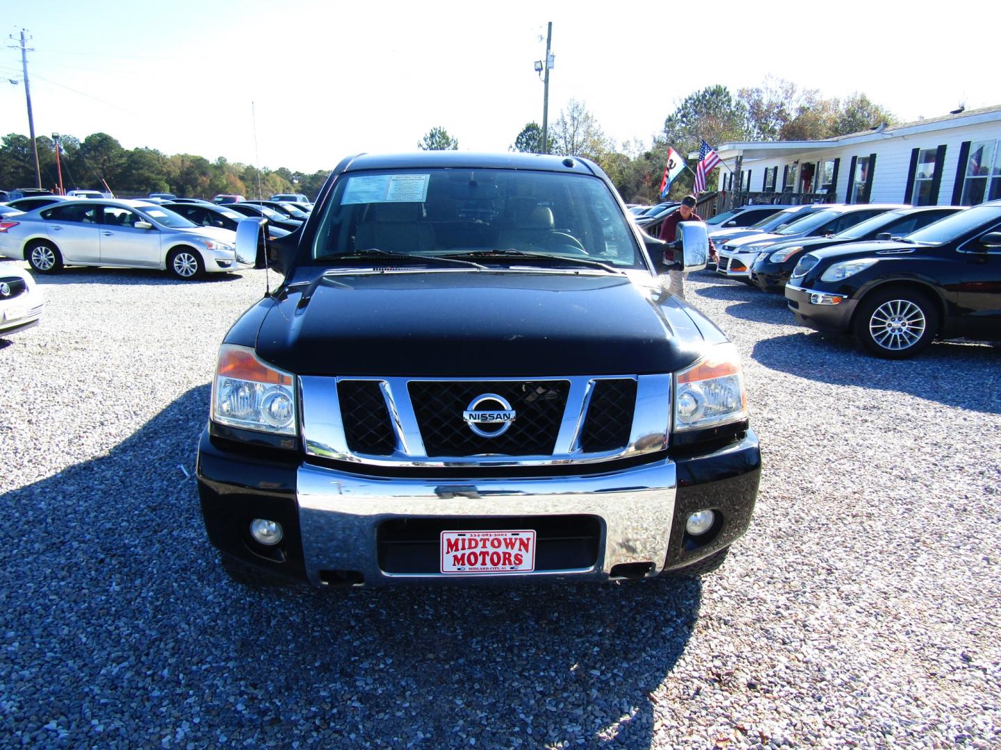 2011 Black /Tan Nissan Titan (1N6BA0ED1BN) , Automatic transmission, located at 15016 S Hwy 231, Midland City, AL, 36350, (334) 983-3001, 31.306210, -85.495277 - Photo#1